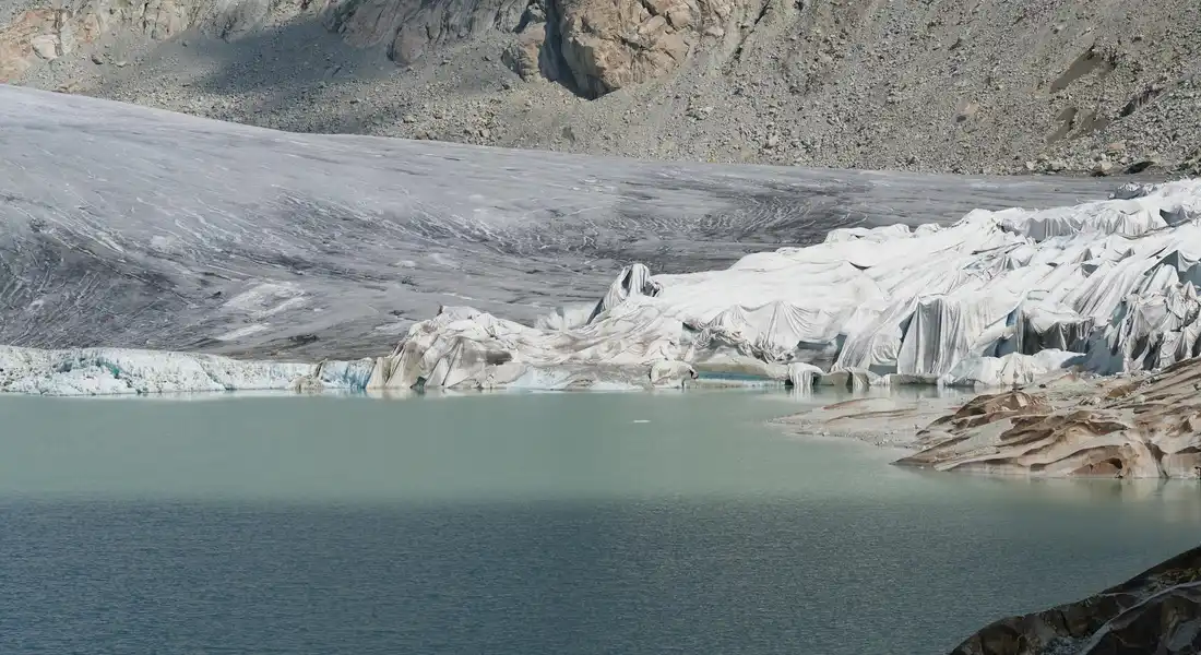 Ice and glacier-fed lake representing hard water minerals impacting hair health