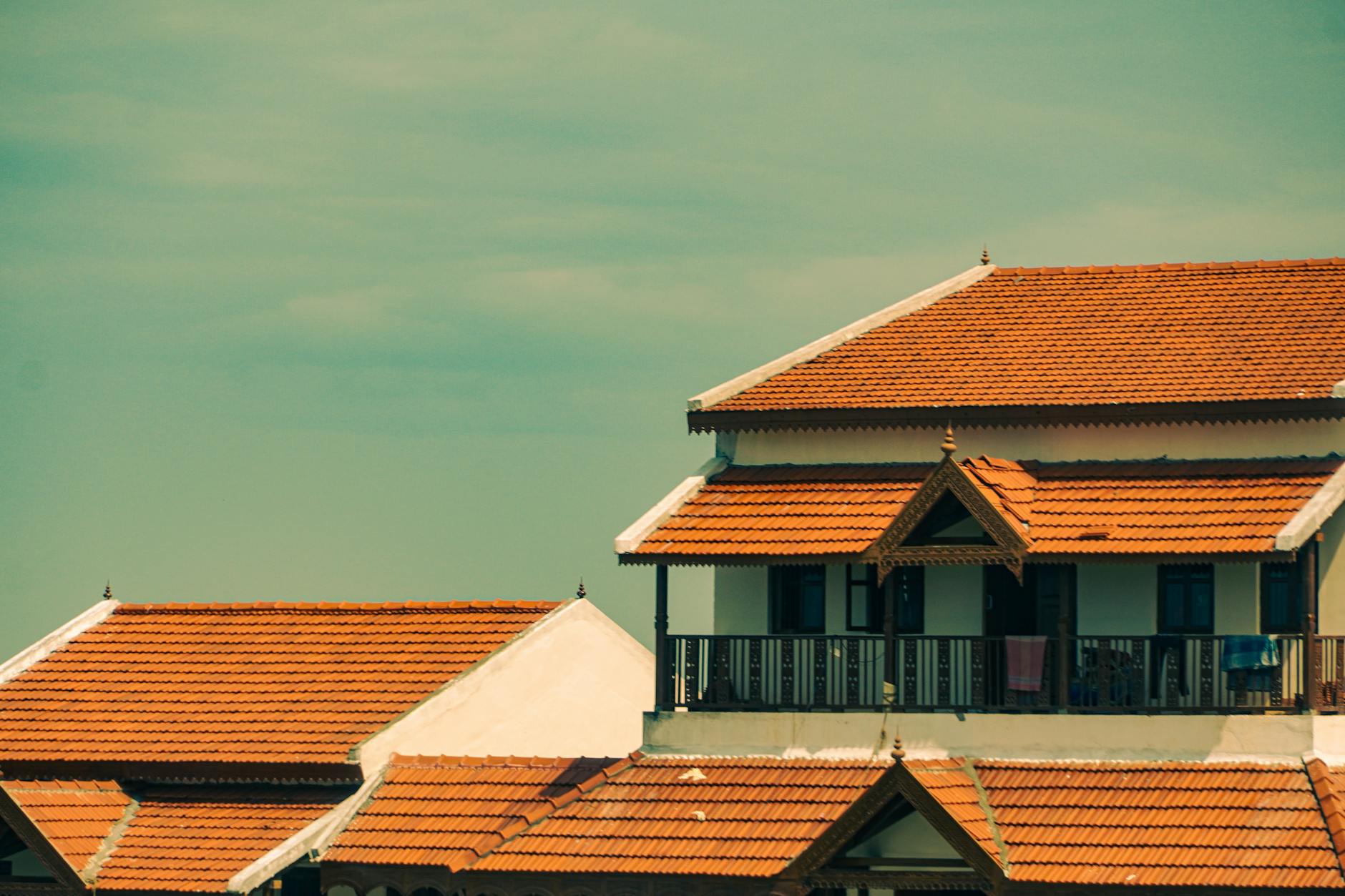 Technician testing water hardness at a kitchen sink using a titration kit.