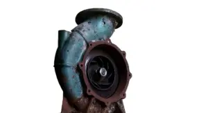 Blue-green jet pump housing with impeller visible inside.