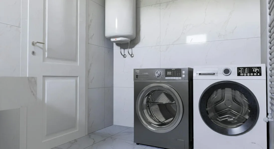 Utility room with a wall-mounted water heater above two front-loading washing machines, in a tiled laundry space.