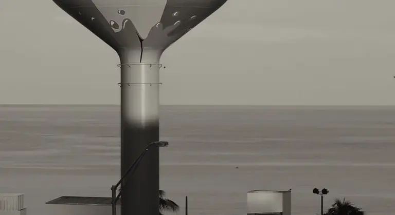 Exterior view of an elevated water storage tank mounted on a vertical pedestal with outlet piping visible against a cloudy sky.