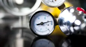 Close-up view of a pressure gauge on a water pressure tank.